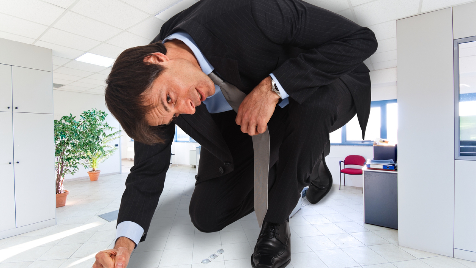 Portrait of businessman in a small office